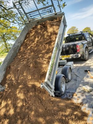 Trailer delivering soil