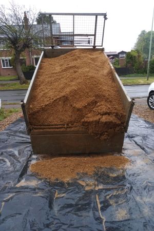 Trailer delivering soil