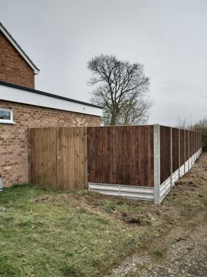 Solid fencing installed with concrete reinforcement