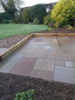 Slabbed patio with wooden trim