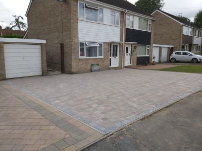 Front garden converted to parking spaces with paving