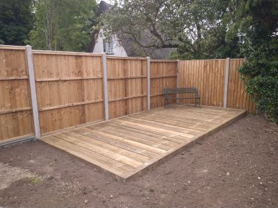 Wooden decking with concrete-reinforced fence