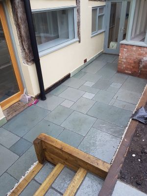 Modern tiled patio with steps