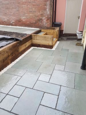 Modern tiled patio with steps