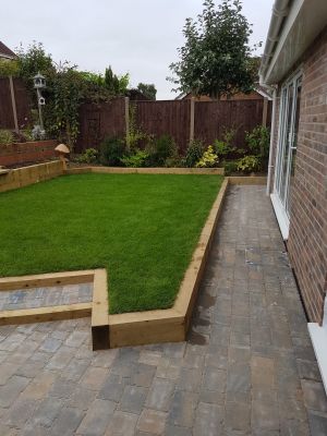 Raised lawn with paved walkway