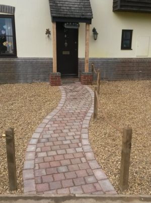 Front garden with shingle and tiled path