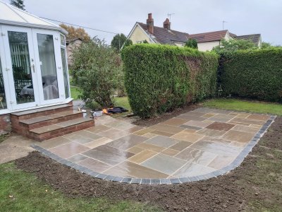 Cosy sandstone patio with grey trim