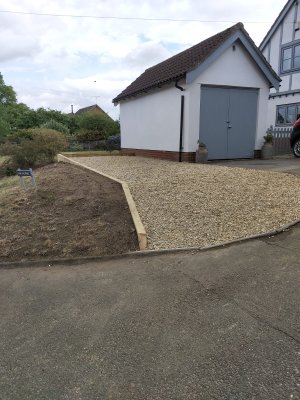 Gravel adjacent to driveway