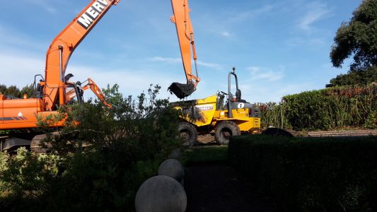 Excavator moving soil